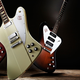 A photo of three Gibson Firebird Guitars.